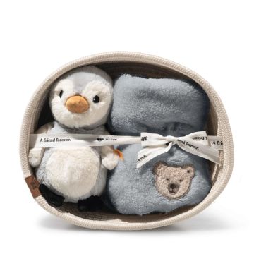 joli coffret naissance de la marque Steiff, un doudou et un hochet dans une jolie corbeille
